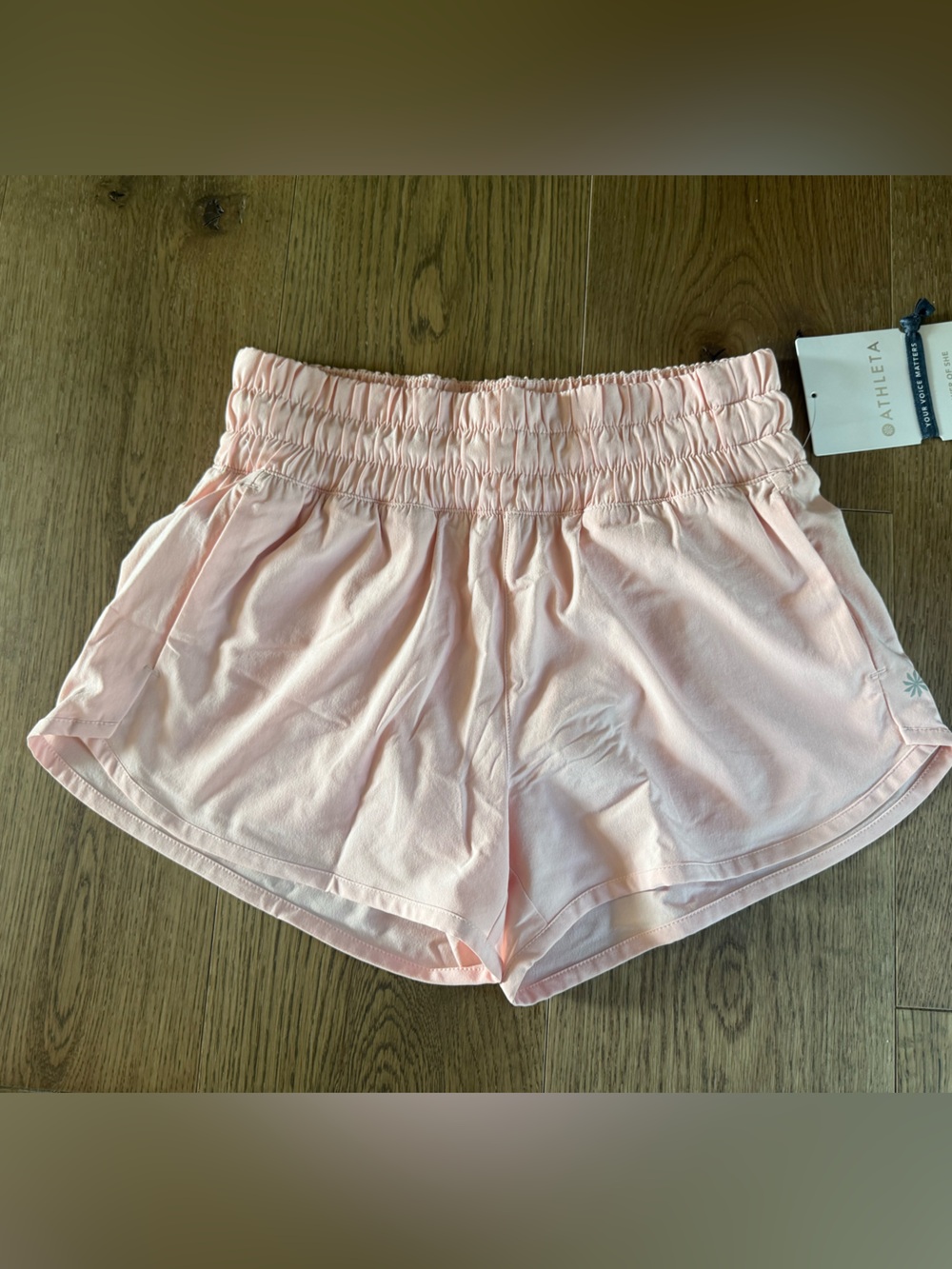 Athleta Girl. Light peach/pink Run free 2.5 short